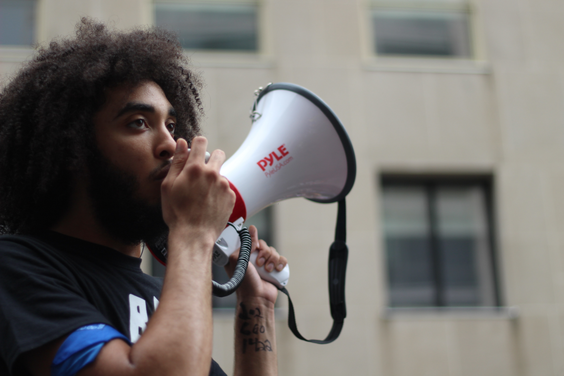 A man speaking into a micophone.