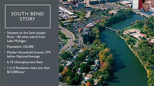 Screen capture of presentation from South Bend's Eric Horvath, with a photo of Eric in the top right corner, an image of South Bend in the middle, and information about South Bend demographics on the left side