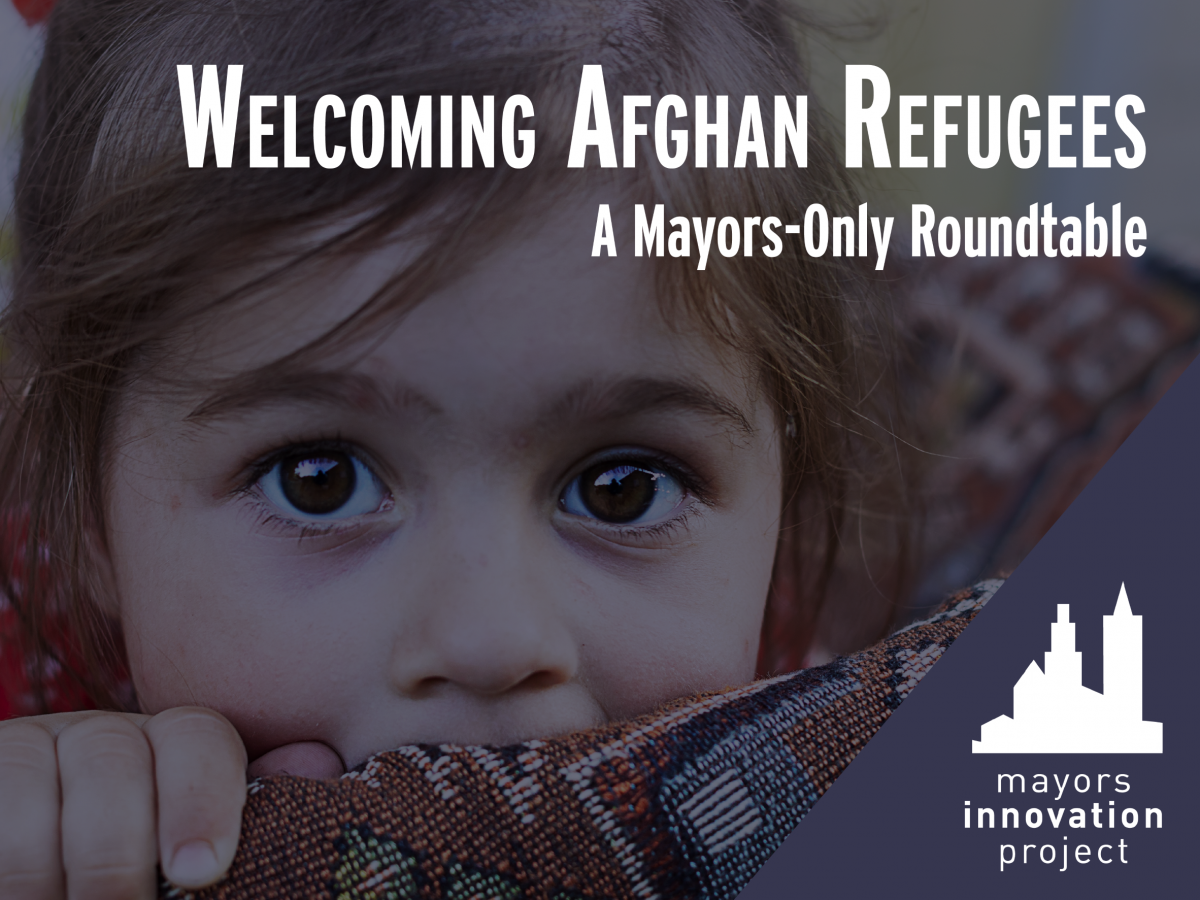 Little girl looking at camera. Text reads'Welcoming Refugees, a mayors-only roundtable'