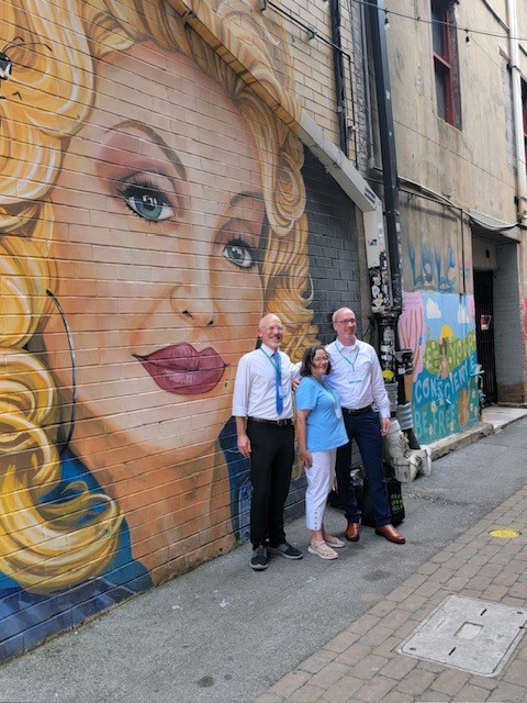 GA Mayors in front of Dolly Parton Mural