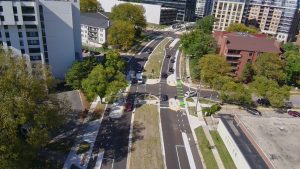 An image of Madison, WI's Segoe Road which has designated bike lines and traffic calming measures .