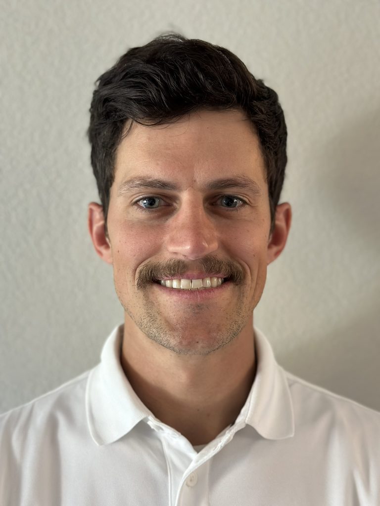 Headshot of Ty Robbins, City Development Liason