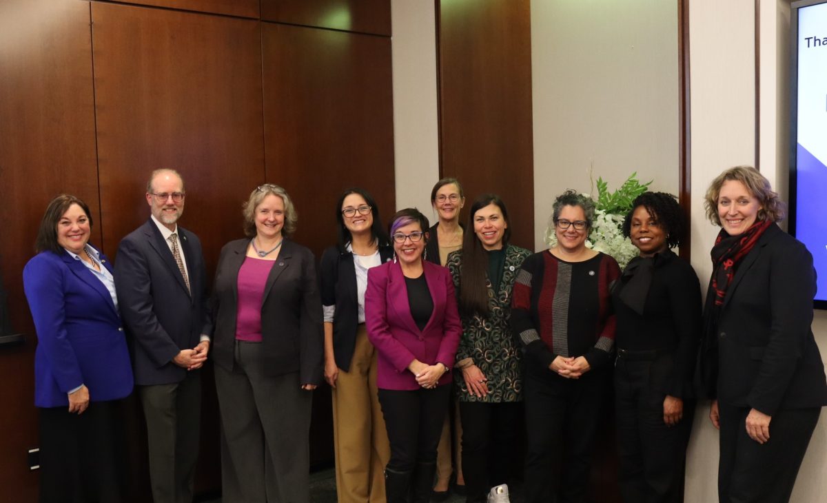 A group of mayors stands together smiling.