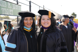Mayor Ishii of Berkeley, CA stands with Berkeley City College President Dr. Denise Richardson at BCC's May 2025 graduation.
