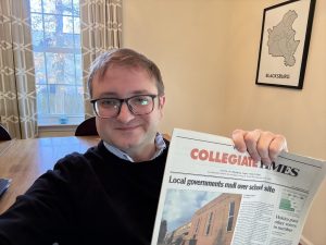 Blacksburg, VA Mayor Michael Sutphin holds a newspaper from 2005.