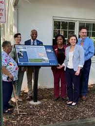 Community leaders, including Mayor Searcy, unveil a historic marker at Heffner Park, 2026